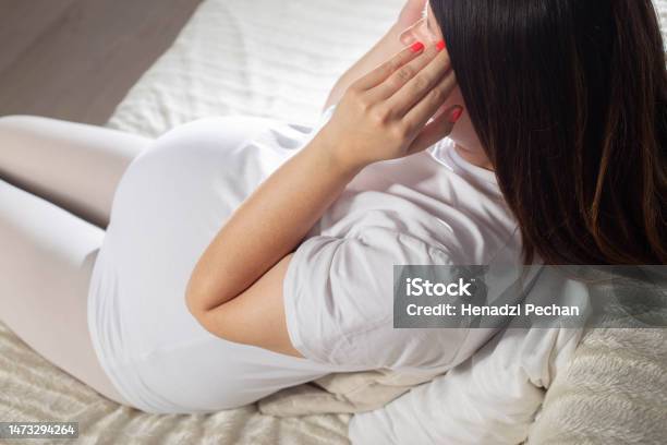 Tinnitus And Presyncope In Pregnant Women Loss Of Consciousness Anemia During Pregnancy Be H3althy Stock Photo - Download Image Now
