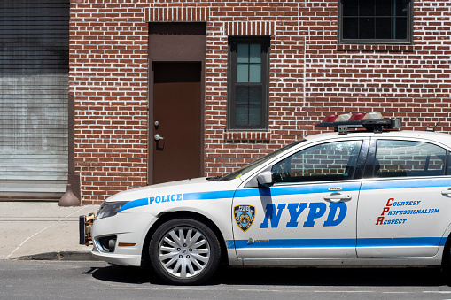 New York, NY, USA - July 4, 2022: A hybrid NYPD police car is seen parked on the streets in Long Island City in the New York City borough of Queens.