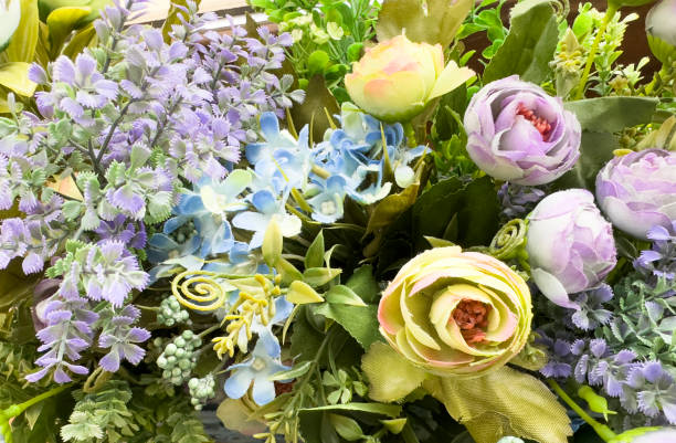 istock Artificial flowers. Beautiful flowers background texture. 1473296559