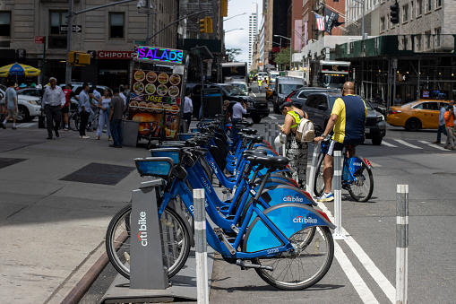 New York, NY, USA - July 6, 2022: A Citi Bike station in Midtown Manhattan, New York City. Citi Bike is NYC's official bike sharing system.