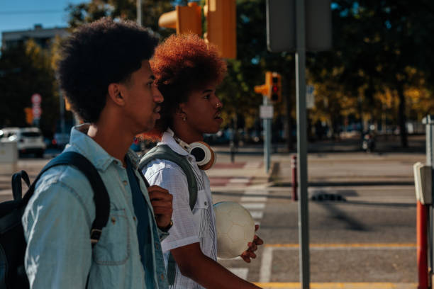 istock African American students walking in city. 1473302975