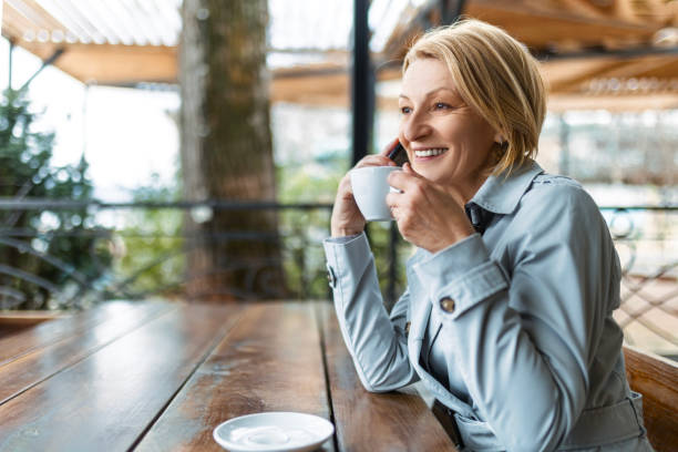 istock Businesswoman enjoying coffee break 1473304480