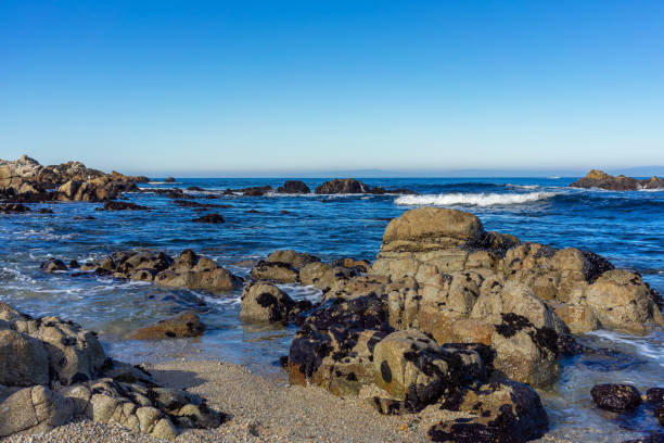 istock Rock formations on a beach in Monterey Bay with a ocean view 1473304671