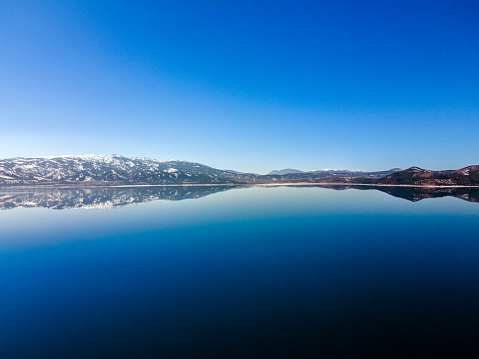 Drone view of beautiful lake with white sandy shore. Salda Lake, Turkey