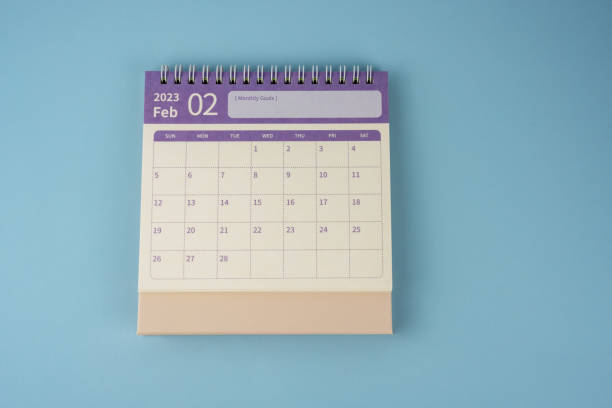 istock February 2023 desk calendar on blue background flat lay 1473306629