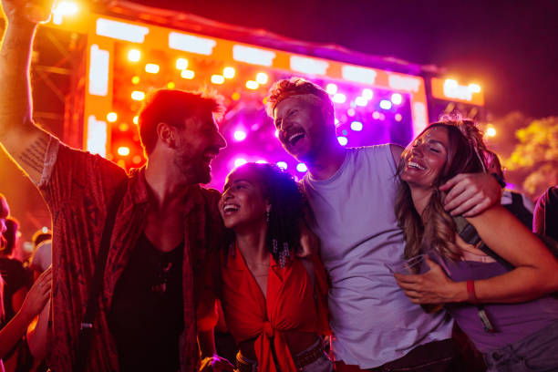 istock Friends enjoying concert. 1473306990