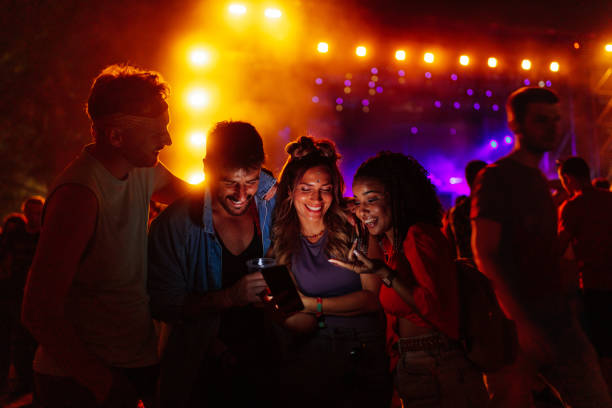 istock Friends at concert using smartphone 1473307002