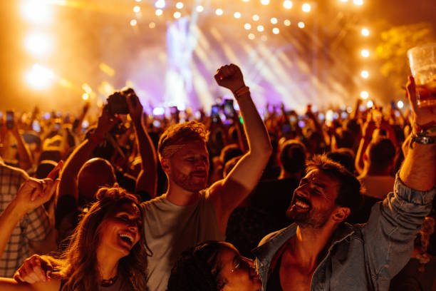 istock Elated group of young adults at concert 1473307004