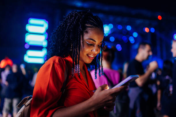 istock Girl texting at concert 1473307112
