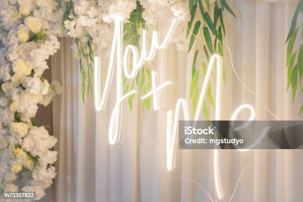 White Wedding Led Sign You And Me With Rose Flowers Stock Photo - Download Image Now