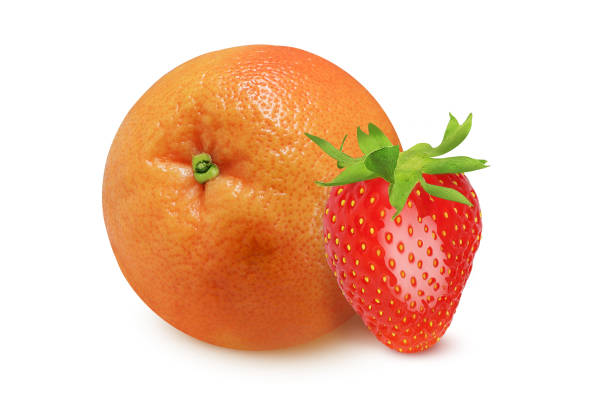 istock Grapefruit and strawberries on an isolated white background. 1473309896