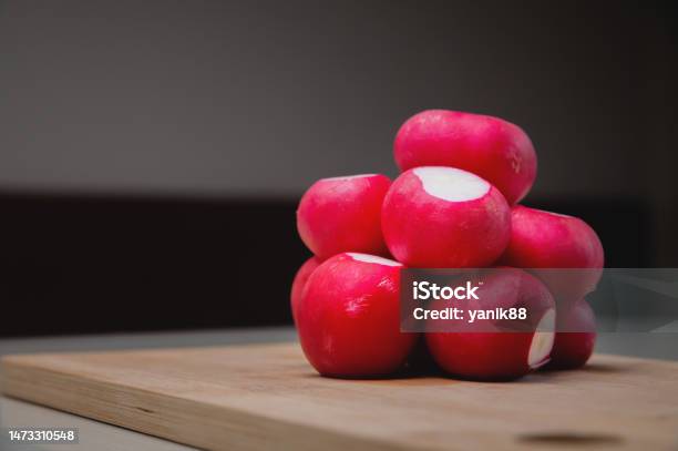 Closeup Fresh Juicy Radish Lies In A Slide On A Wooden Board Advertising Banner Stock Photo - Download Image Now