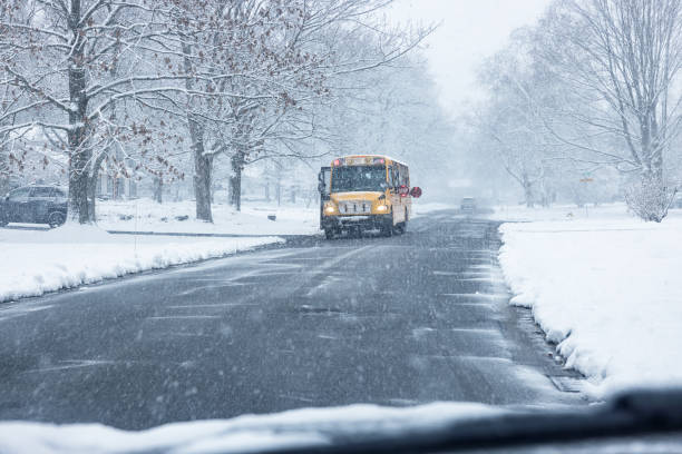 istock School Bus Stopped on Suburban Street During Blizzard Snow Storm 1473314317