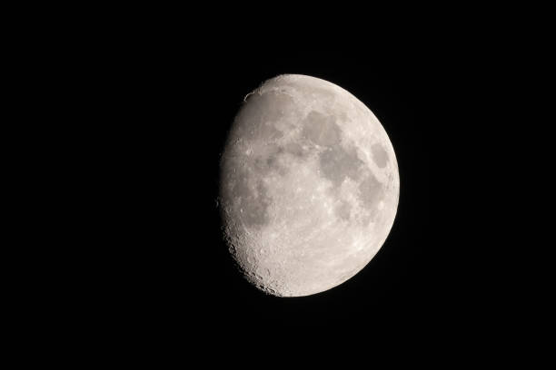 istock Telephoto image of three-quarter moon with many craters 1473318752