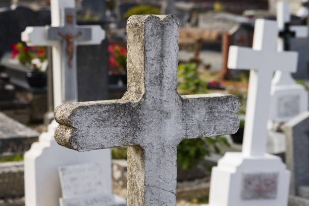istock concrete tombstone on a cemetery 1473320781