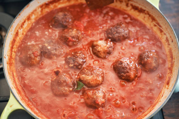 istock Preparing Meatballs with Tomato Sauce in a Pan 1473323681