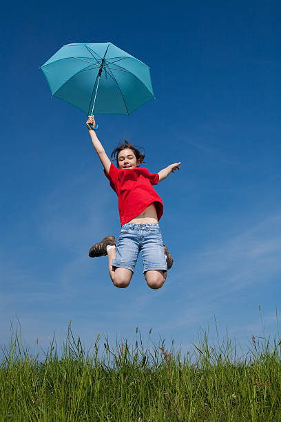 istock Girl jumping outdoor 147332438