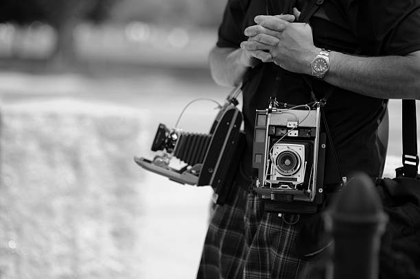 Photographer with old cameras stock photo