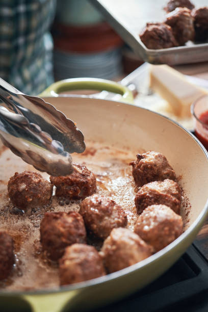 istock Preparing Meatballs in a Pan 1473329141