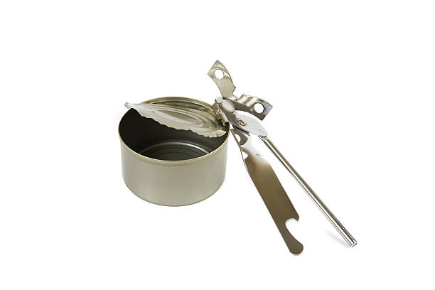 Can opener with empty tin stock photo