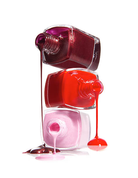 istock Three opened reddish nail polish jars stacked and spilling 147332967