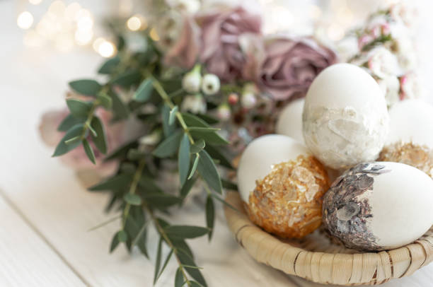 istock Easter composition with decorative eggs and flowers, close-up. 1473330884