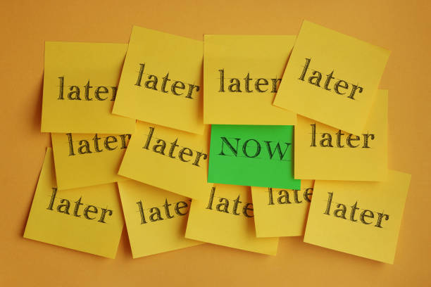 Now and later with adhesive notes - fotografia de stock