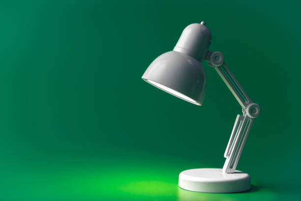istock White table lamp on a green background, copy space. 1473332920