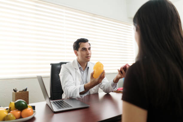 istock Latin nutritionist explaining about fat and muscle 1473334178