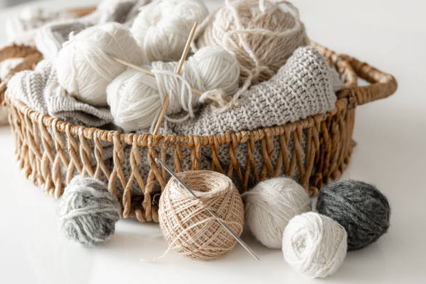 istock Basket with yarn close-up, threads for knitting. 1473334295