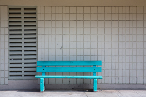 A bright blue bench.