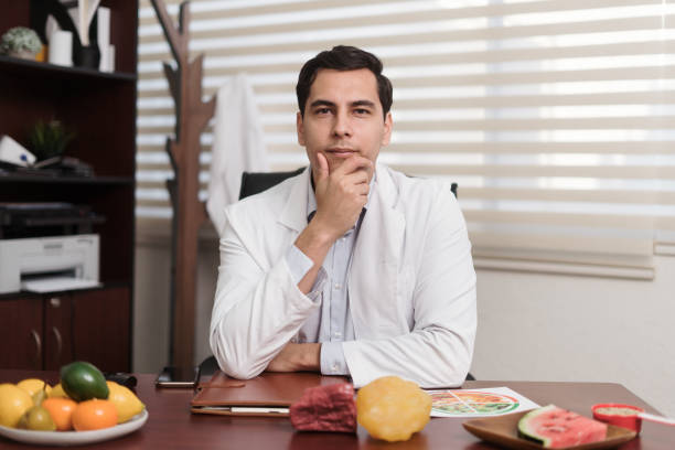 istock Male nutritionist with hand on chin looking at camera 1473336695