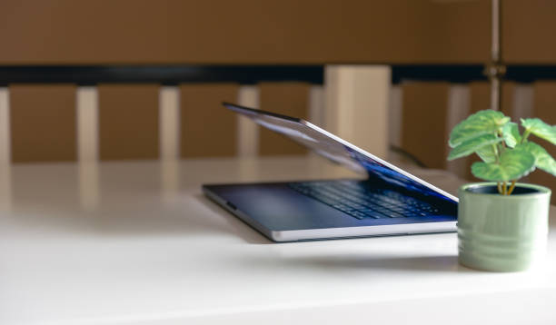 istock Laptop on the desktop on a blurred background. 1473337905