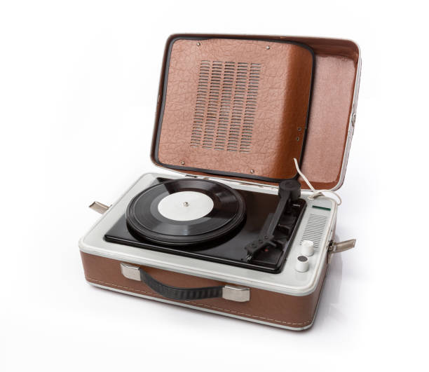 istock Vintage foldable portable vinyl player with a black sinlge vinyl plate on a turntable. 1473338523