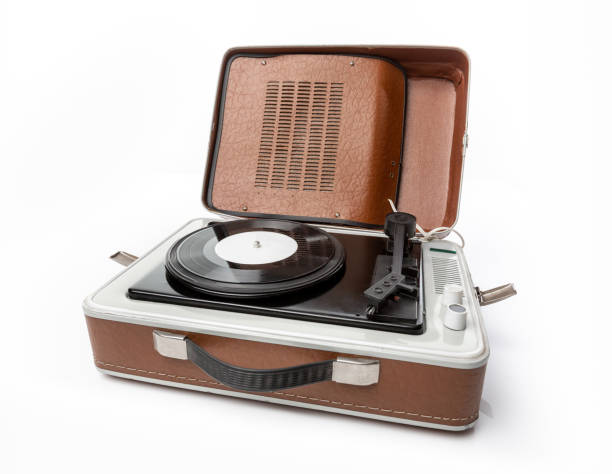 istock Vintage foldable portable vinyl player with a black sinlge vinyl plate on a turntable. 1473338528