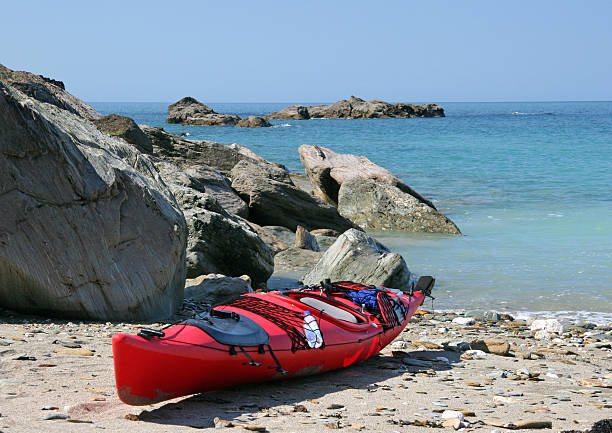 Red sea kayak on the beach stock photo