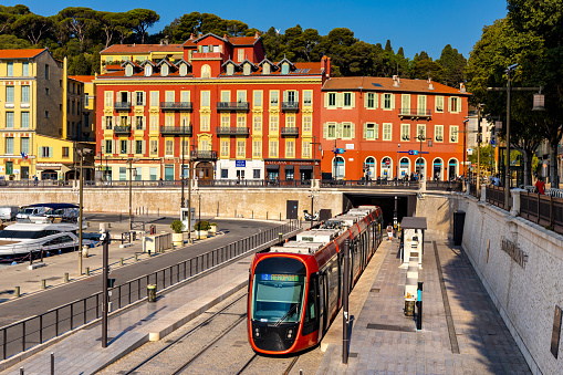 Nice, France - August 5, 2022: Port Lympia tram street car station at Place de lIle de Beaute square in historic Nice Port and yacht marina district on French Riviera