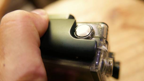 istock A 4k camera. Person holding an action camera. Man using a camera. Person testing a digital camera. Action camera close-up shot 1473339644