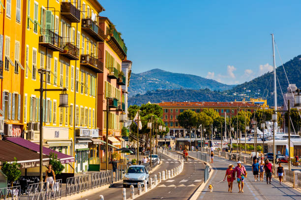 Colorful tenement houses along Quai Papacino street in historic Nice Port district on French Riviera in France stock photo