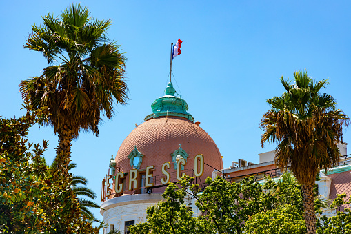 Nice, France - August 7, 2022: Le Negresco luxury French style hotel at Promenade des Anglais along historic old town Nice beach on French Riviera Azure Coast