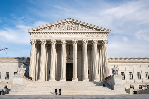 Washington, DC, US-February 6, 2023: Imposing facade of the United States Suprement Court in Washington, DC with blue sky and copy space.