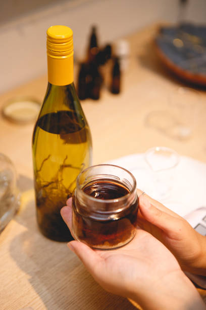 brazilian woman making natural perfumes in her workshop