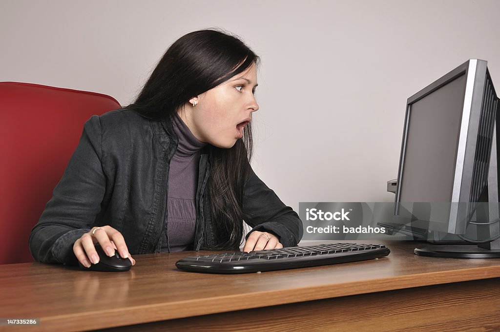 surprised woman surprised woman in the workplace Adult Stock Photo