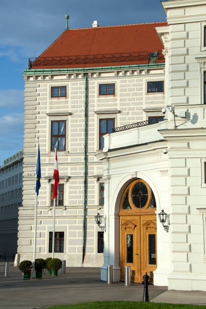 istock Vienna Historic Buildings With Flags In The Evening 1473354879
