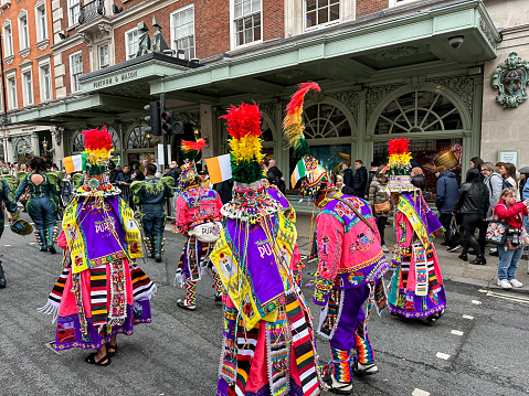 Women and men dancing in traditional Bolivian dress at St Patrick's Day Parade, London, Sunday 12 March 2023