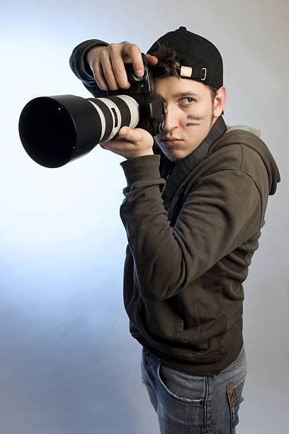istock Young man with a photo camera 147336983