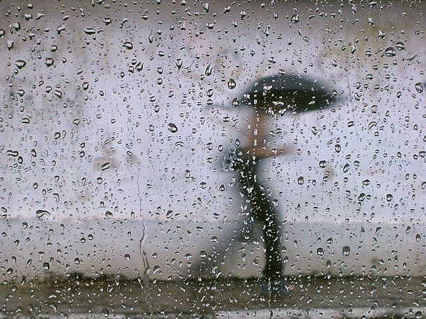 istock Rain drops in the window glass and a bokeh background 147337164
