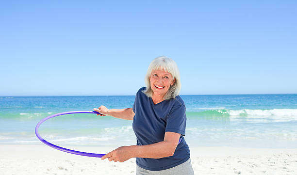istock Senior woman playing with her hoop 147337334