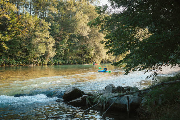istock Whitewater kayaker paddling on river 1473373757