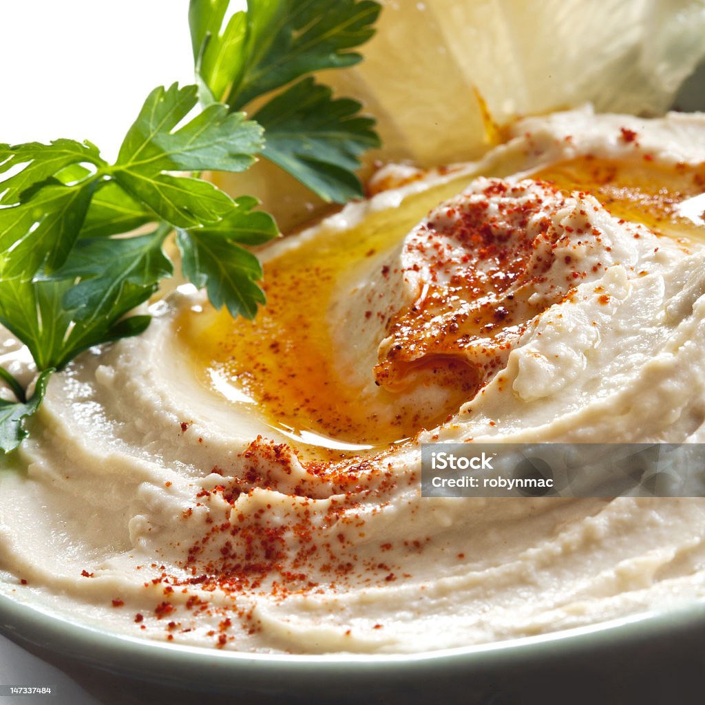 Hummus Bowl of hummus topped with paprika.  Traditional chickpea dip. Food Stock Photo